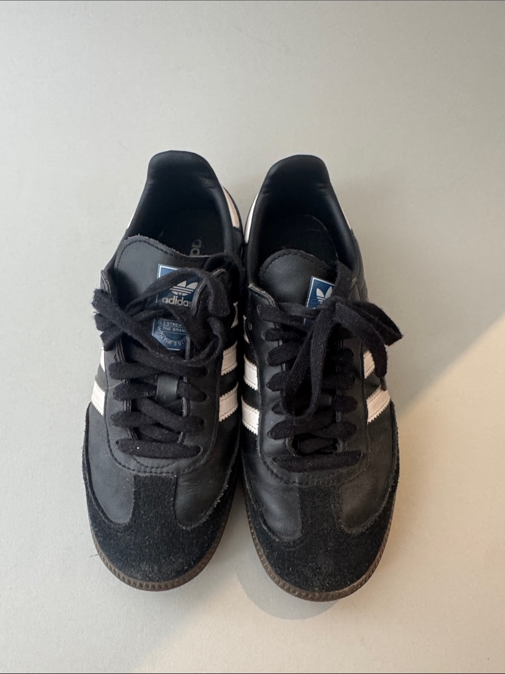 adidas Men’s Black Sneakers with White Stripes